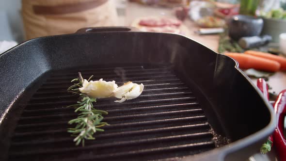 Melting Butter, Rosemary and Garlic on Hot Grill Pan