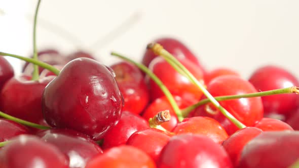 Tart or draft red and fresh cherries pile food background 4K 2160p 30 fps slow tilt UHD video - Prun