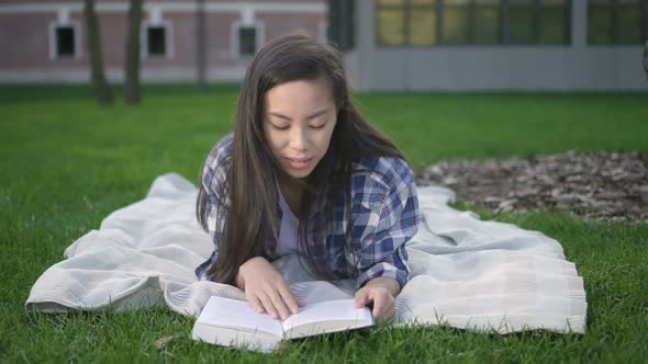 Front View of Happy Asian Student Girl Model with Dark Hair Making Research in Communication Area