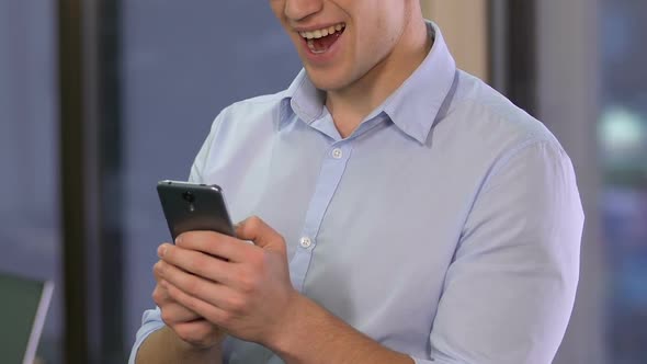 Male Office Worker Scrolling Smartphone, Checking Data in Mobile Business Tool