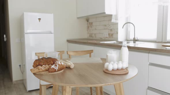 Products for Baking Homemade Ecofriendly Bread are Lying on the Table of Bright Kitchen