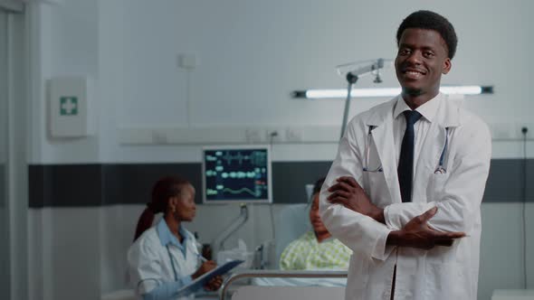 Portrait of Man with Doctor Job Standing in Hospital Ward