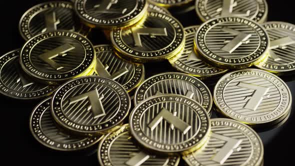 Rotating shot of Bitcoins (digital cryptocurrency) - BITCOIN LITECOIN 240