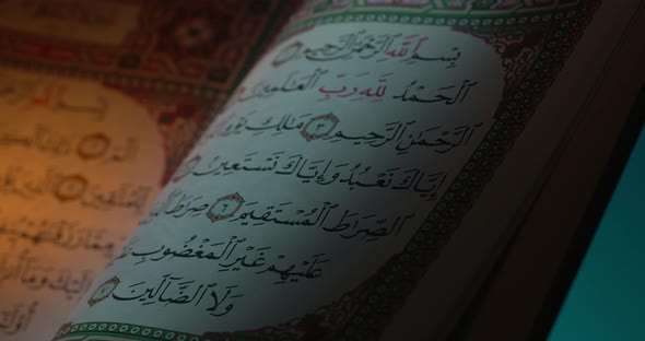 Holy Quran On Book Rest With Prayer Beads