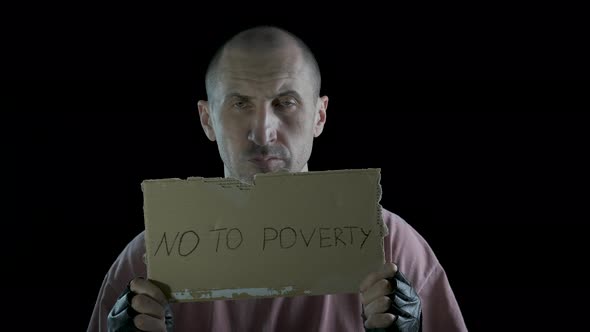 No poverty. A man with a sign of no poverty