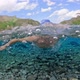 Young male Swims without a mask in a clear alpine lake - VideoHive Item for Sale