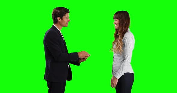 Caucasian man giving car keys to the lessor with green screen