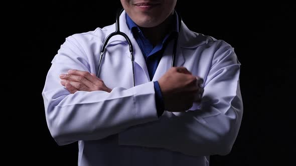 Close-up shot: Doctor wearing lab uniform of hospital.