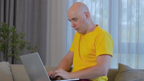 Freelancer Concerned Caucasian Man Working on a Laptop,tired,closing Rubs Her Eyes From Fatigue