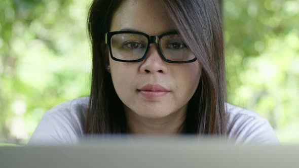 Asian Woman Working with Laptop