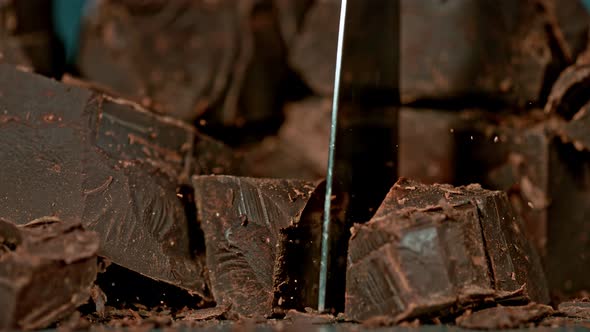 Super Slow Motion Shot of Cutting Raw Chocolate Chunk at 1000 Fps.