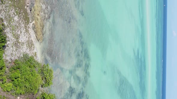 Vertical Video of the Ocean Near the Coast of Zanzibar Tanzania Aerial View