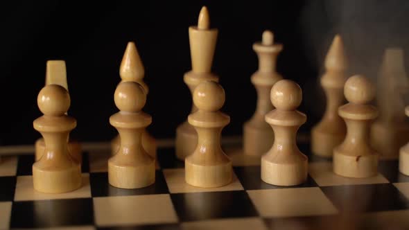 White Wooden Pieces on a Chessboard