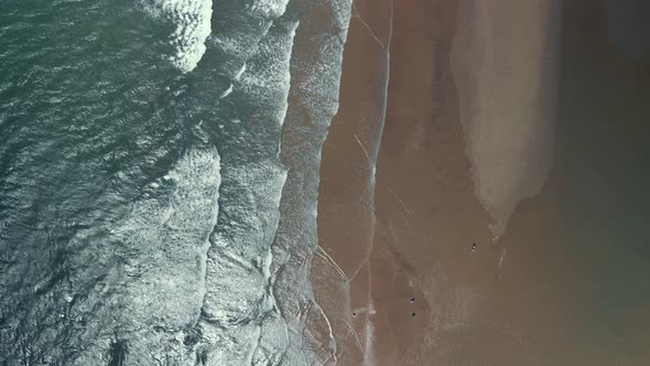 Bird'seye View of the Ocean and the Sandy Beach at Sunset