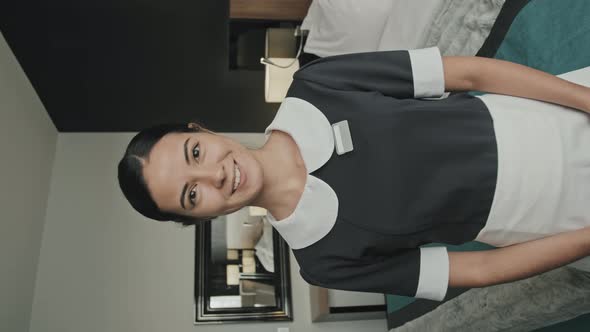 Vertical Portrait of Hotel Housekeeper