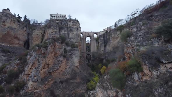 Aerial: New bridge that joins Ronda Spain spans deep vertical gorge