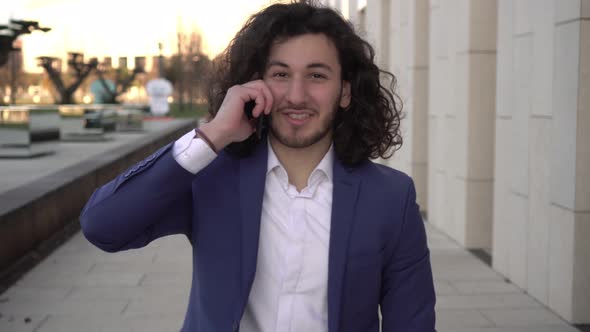 Successful Businessman Talking on the Phone Outdoors