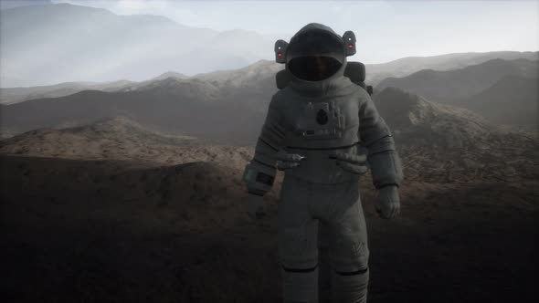 Astronaut on Another Planet with Dust and Fog alt