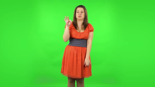 Cute Girl Is Showing Disgust for Bad Smell or Taste. Green Screen