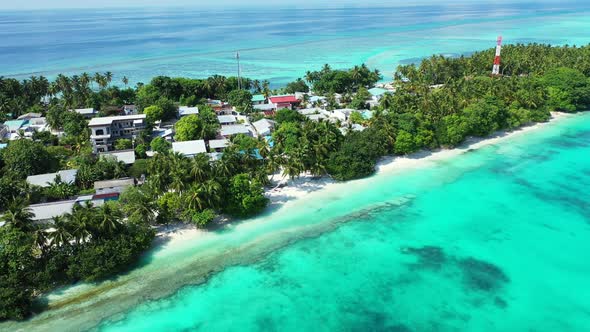 Daytime overhead abstract view of a paradise sunny white sand beach and blue ocean background in col