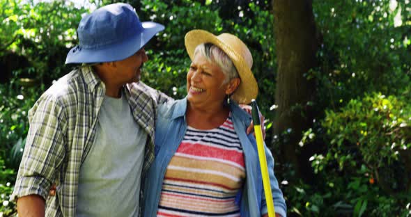 Senior couple hugging each other in garden