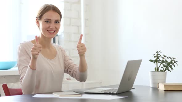 Thumbs Up Gesture by Woman in Loft Office