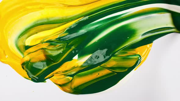 Artist Mixing Ingredients Green and Yellow Watercolor Using Palette Knife and Pigments on White