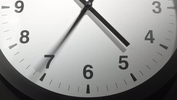 Clock Face In Time Lapse On Dark Grey Wall 