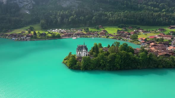 Scenic castle on lake Brienz amazing water color, Iseltwald, Switzerland