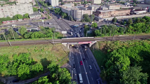 Cars and Trucks Driving Along Road and Bridge