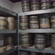 Old round metal boxes, in a dusty vault and leaves. Аrchive with old film tapes. Film storage room - VideoHive Item for Sale