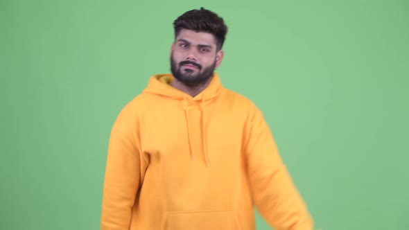 Happy Young Overweight Bearded Indian Man with Ok Sign