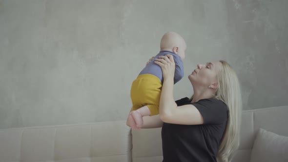 Woman playing with toddler at home