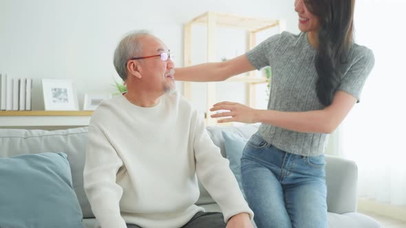 Asian lovely family, young daughter greeting and hugging older father.