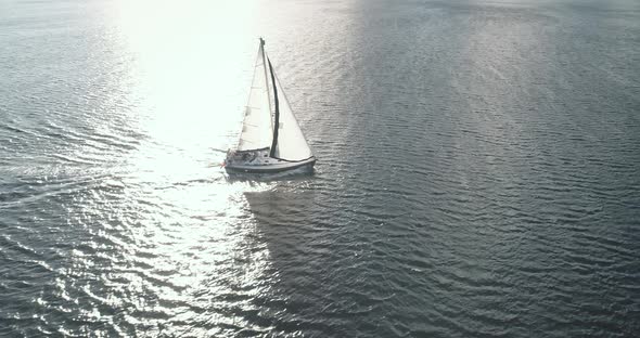 Sun Seascape with Alone Sail Boat Aerial