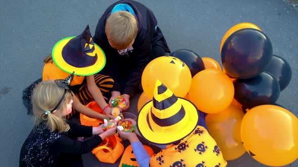Children in Costumes are Celebrating Halloween