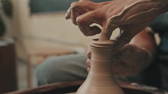 Shaping Vase on Pottery Wheel