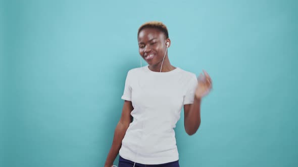 Portrait of Happy Afro Woman Dancing and Listening To Music