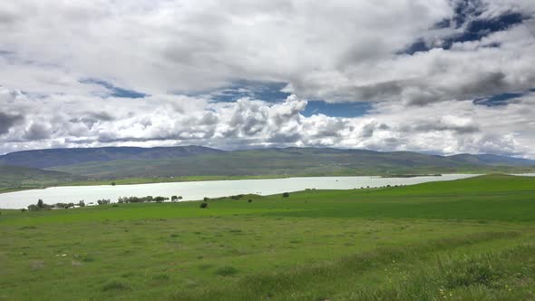 Green Meadows and Fields Around The Lake