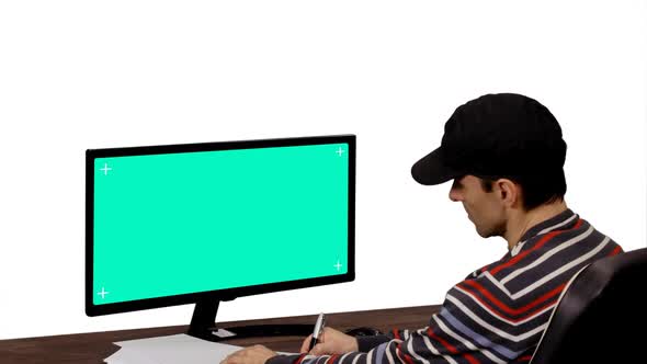 A Man Looking at Mockup Green Screen, Alpha Channel