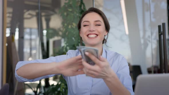 Young Girl Office Worker Sitting At The Table