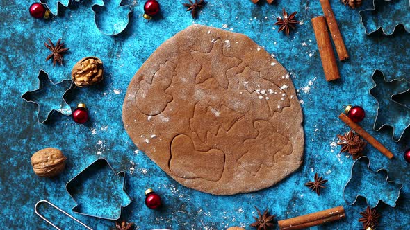 Christmas Baking Concept. Gingerbread Dough with Different Cutter Shapes