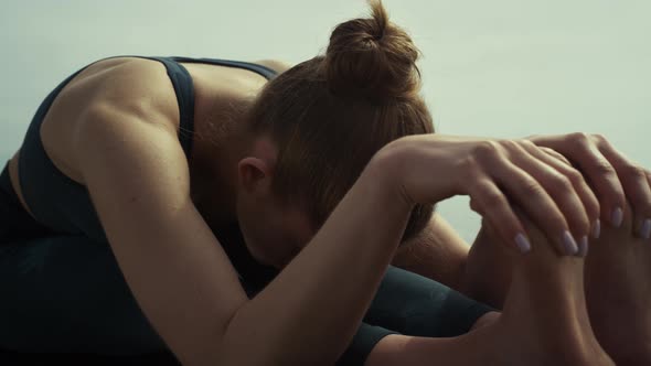 Attractive Girl Sitting Yoga Pose on Beach Close Up