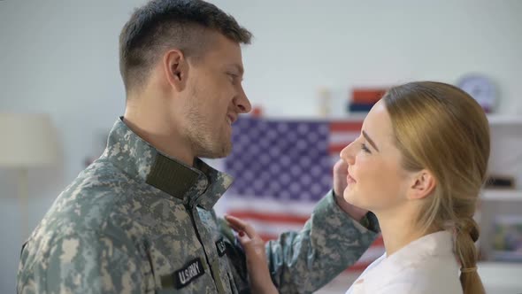 US Soldier in Uniform Hugging Girlfriend and Smiling at Cam Homecoming After War