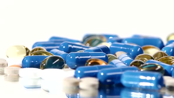 Medical Pills, Tablets and Capsules, Rotation, Reflection, Close Up, on White