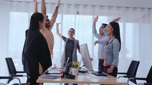 Successful Business People Celebrating Project Success at Office