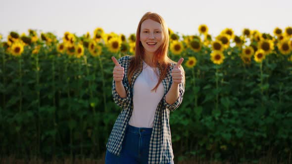 A Young Woman with Ginger Hair is Showing Both Her