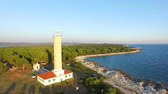 Flying over people visiting a lighthouse, Croatia