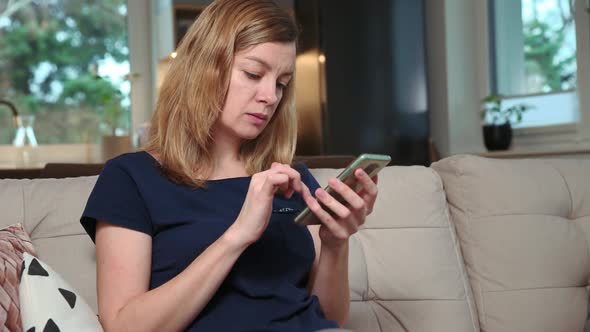 Woman Using Smartphone for Surfing News