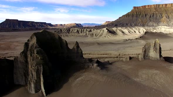 Aerial pan of layers of the desert landscape passing by